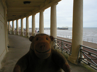 Mr Monkey walking through the colonnades at Blackpool
