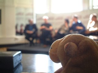 Mr Monkey looking at a panel of authors