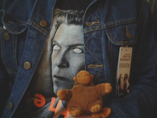 Mr Monkey posing with a David Bowie T-shirt