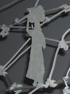 A cut-out figure on the netting of Memento