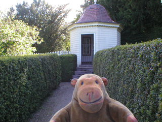 Mr Monkey looking at George Washington's seed house