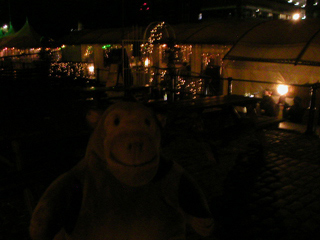 Mr Monkey outside Apple on Welsh Back in the dark