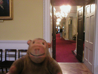 Mr Monkey looking down the corridor from the front door