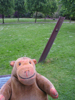 Mr Monkey looking at the tramline in the churchyard