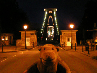 Mr Monkey looking at the Clifton suspension bridge from the western end
