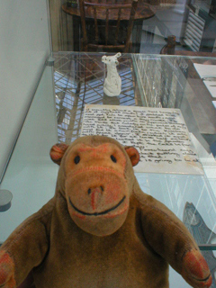 Mr Monkey looking at a ceramic mouse