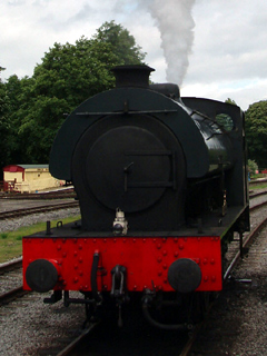 Front view of an Austerity saddle tank letting off steam