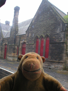 Mr Monkey looking at the down side buildings at Darley Dale