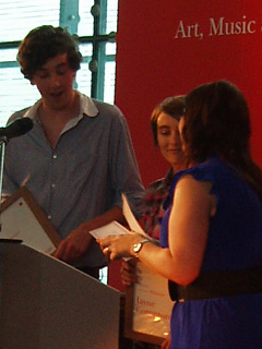 Jayne Compton and Max Moran collecting their music awards