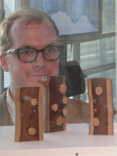 Simon Blackmore of the Owl Project with a display case of iLogs