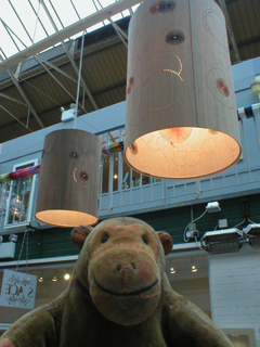 Mr Monkey looking at lampshades by Jane Blease