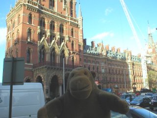 Mr Monkey with St Pancras station behind him
