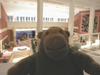 Mr Monkey looking down on the atrium of the Library