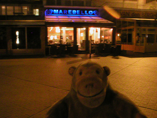 Mr Monkey outside the Marebello at night