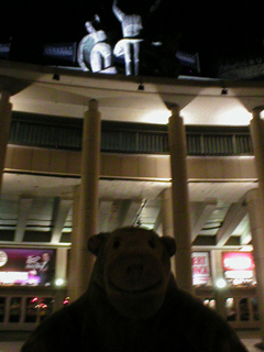 Mr Monkey looking up at the Casino at night