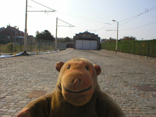 Mr Monkey walking towards the old tram depot at De Panne