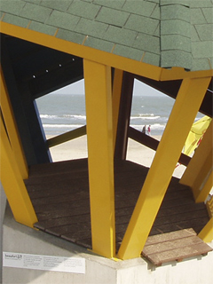 The sea seen through the yellow booth of the Wild Shore Trilogy