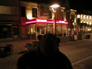 Mr Monkey outside De Roos at night