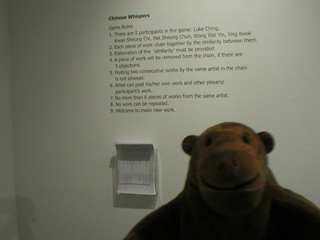 Mr Monkey reading the rules of Chinese Whispers