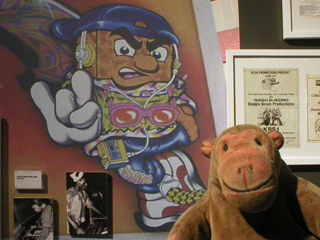 Mr Monkey looking at a hip hop Weetabix character