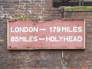 A sign at Chester reading London 179 miles 85 miles Holyhead