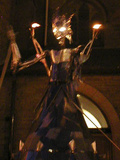 The Fire Queen raising her arms and starting to move