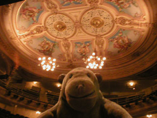 Mr Monkey looking at the decorated ceiling from the stage