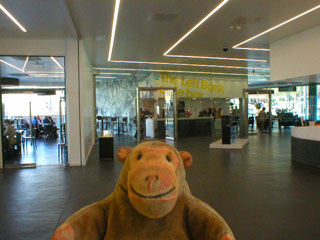 Mr Monkey looking at Left Bank cafe on the ground floor of the museum