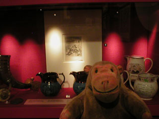 Mr Monkey looking at a cabinet of Peterloo memorabilia