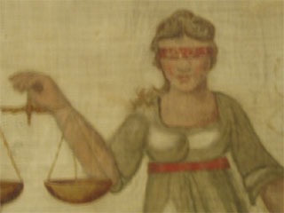 The non-blindfolded woman on the banner