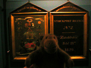 Mr Monkey looking at the painted panels of the Stockport Branch No 2 of the United Friendly Mechanics