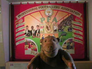 Mr Monkey looking at the banner of the Professional Footballers' Association