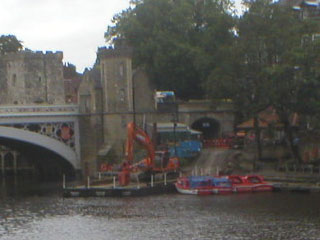 A digger on the path beside the Lendal bridge
