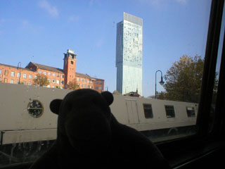 Mr Monkey looking up at Beetham Tower
