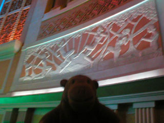 Mr Monkey looking at a frieze of 'Egyptian' nymphs