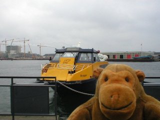 Mr Monkey with the water taxi behind him at Nyhavn
