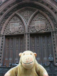 Mr Monkey looking at the old front doors of the Library