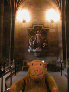 Mr Monkey looking at the scupture in the entrance hall