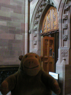 Mr Monkey in front of the door into the Reading Room