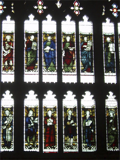 Secular figures in the stained glass of the east window