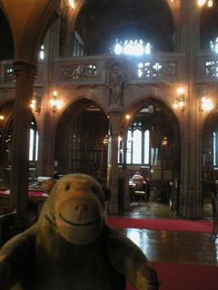 Mr Monkey looking across the Reading Room from one of the study alcoves
