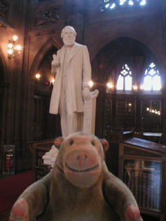 Mr Monkey looking at John Cassidy's statue of John Rylands