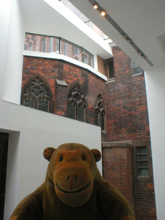 Mr Monkey looking at the junction of the old and new buildings