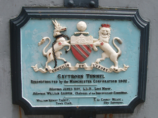 The plaque above the east end of the tunnel