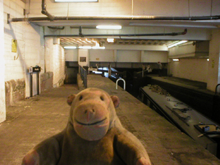 Mr Monkey looking at Lock 85 underneath 111 Piccadilly