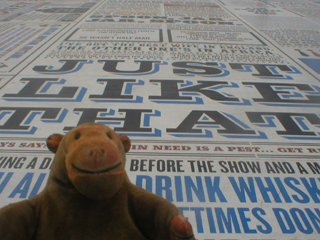 Mr Monkey looking at the Tommy Cooper panel of the Comedy Carpet