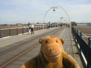 Mr Monkey looking down the pier towards Southport