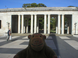 Mr Monkey looking at one of the memorial's colonnades