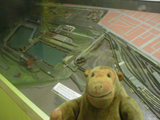 Mr Monkey examining a model of Fleetwood Docks