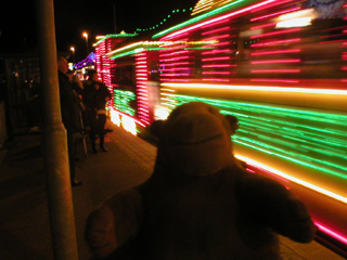 Mr Monkey watching the Santa Fe tram roll past